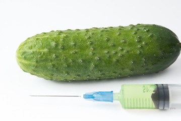 cucumber and syringe. genetic modification food