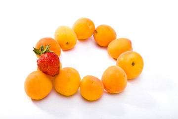 Ripe apricots and berry of strawberry