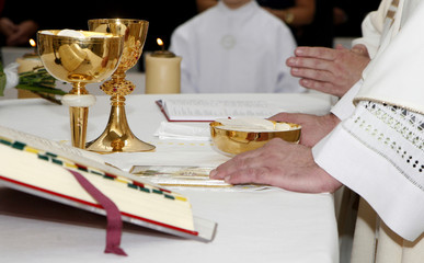 hands of priest by the mass