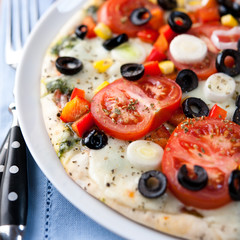 Pizza with mozzarella and vegetables