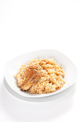 rice dish with potatoes and pork chops