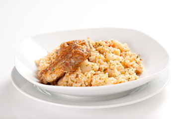 rice dish with potatoes and pork chops