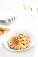 rice dish with potatoes and pork chops