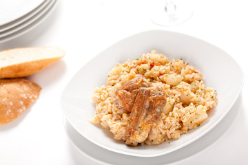 rice dish with potatoes and pork chops