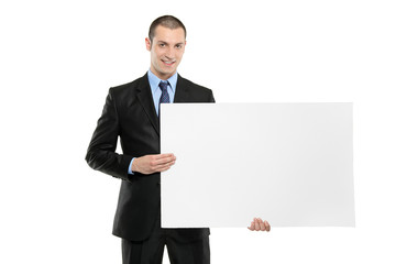 A young businessman holding a white blank card