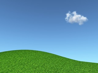 grassy hill and blue sky with a cloud