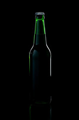 a green bottle beer over black background with shadow