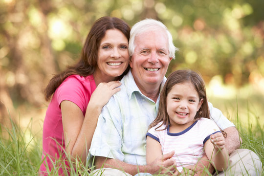 Grandfather With Daughter And Granddaughter In Park