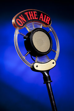 photo of radio microphone on blue background