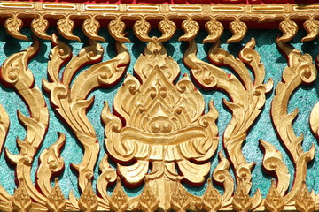 Fototapeta na wymiar Thai art carving on gable of temple, Wat Lhao Yao, Borabue,