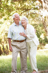 Obraz premium Senior Couple Walking In Park