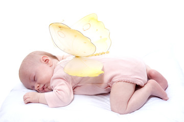 Fototapeta na wymiar bébé qui dort sur le ventre