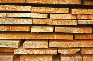 Close up view of old stacked wooden boards