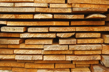 Close up view of old stacked wooden boards