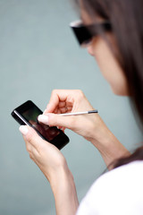 Women looking for data on their mobile