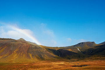 Beautiful rainbow over the mountains, North Fjords Iceland