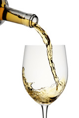 White wine poured in a glass isolated on a white background