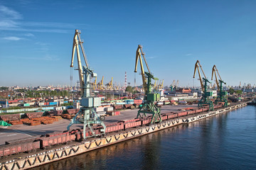 Fototapeta premium Cranes and freight trains in harbor