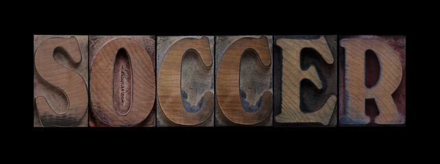 the word soccer in old letterpress wood type