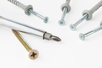 screwdriver with screw over white