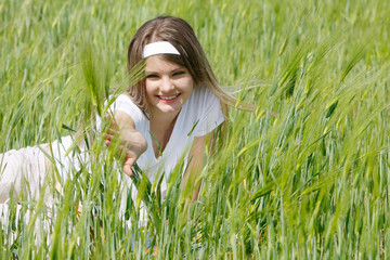 yougn happy girl in green grass