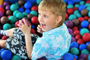 Fototapeta na wymiar boy playing with balls