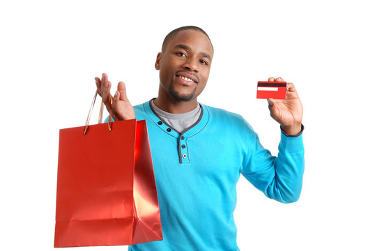 African american man with shopping bag and credit card