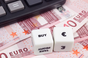 Euro currency with calculator and dice