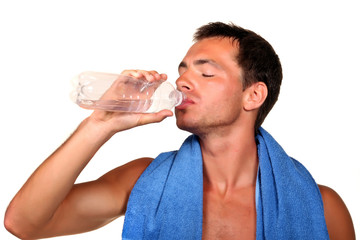 Man with a towel drinking water