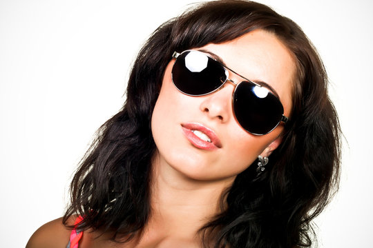 Young beautiful woman in sunglasses
