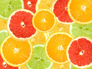 Foto op Plexiglas Abstracte achtergrond van plakjes citrus © Boroda