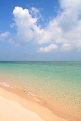 Sea, sand, and clouds