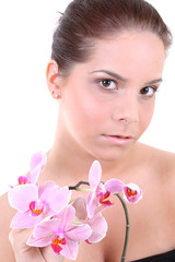 Fototapeta premium Young beautiful healthy woman with orchid