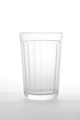 single empty glass isolated on white.