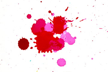 red and pink ink blot on white background