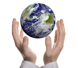 Earth in hands over white background