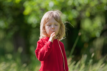 boy with grass straw