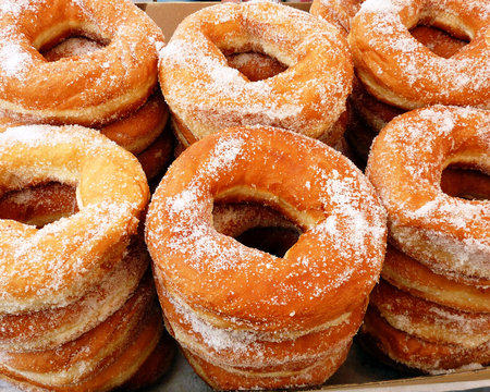 Piles of greek round sugar donuts "lukuma"