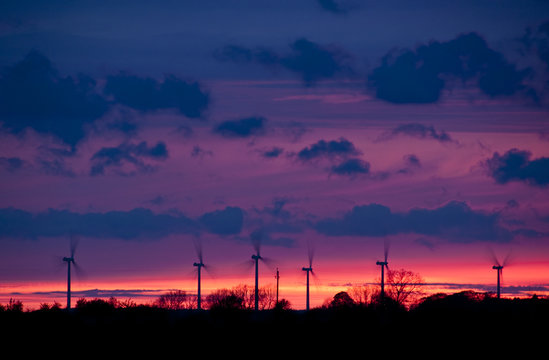 windmills in sunset