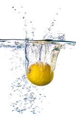 Lemon splashing into water isolated on white background