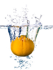 Fototapeta na wymiar Orange splashing into water isolated on white