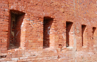 Loopholes in an old brick wall
