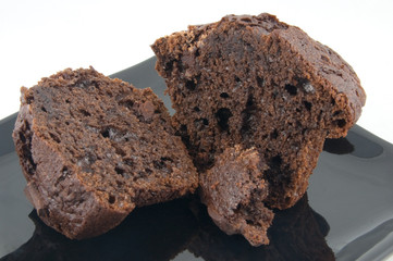 sliced chocolate muffin on black plate