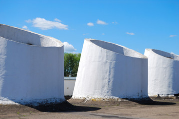 Three white ventilating pipes