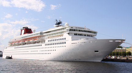 Fototapeta na wymiar luxury white cruise ship shot at angle at water level