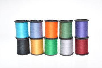 Thread Spools Stacked on White