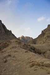 Scenic of desert mountains with blue sky.