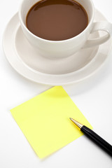 Coffee cup and notes