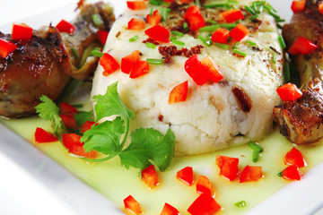 chicken drumsticks served with mash