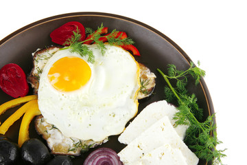 fried egg served on dark plate